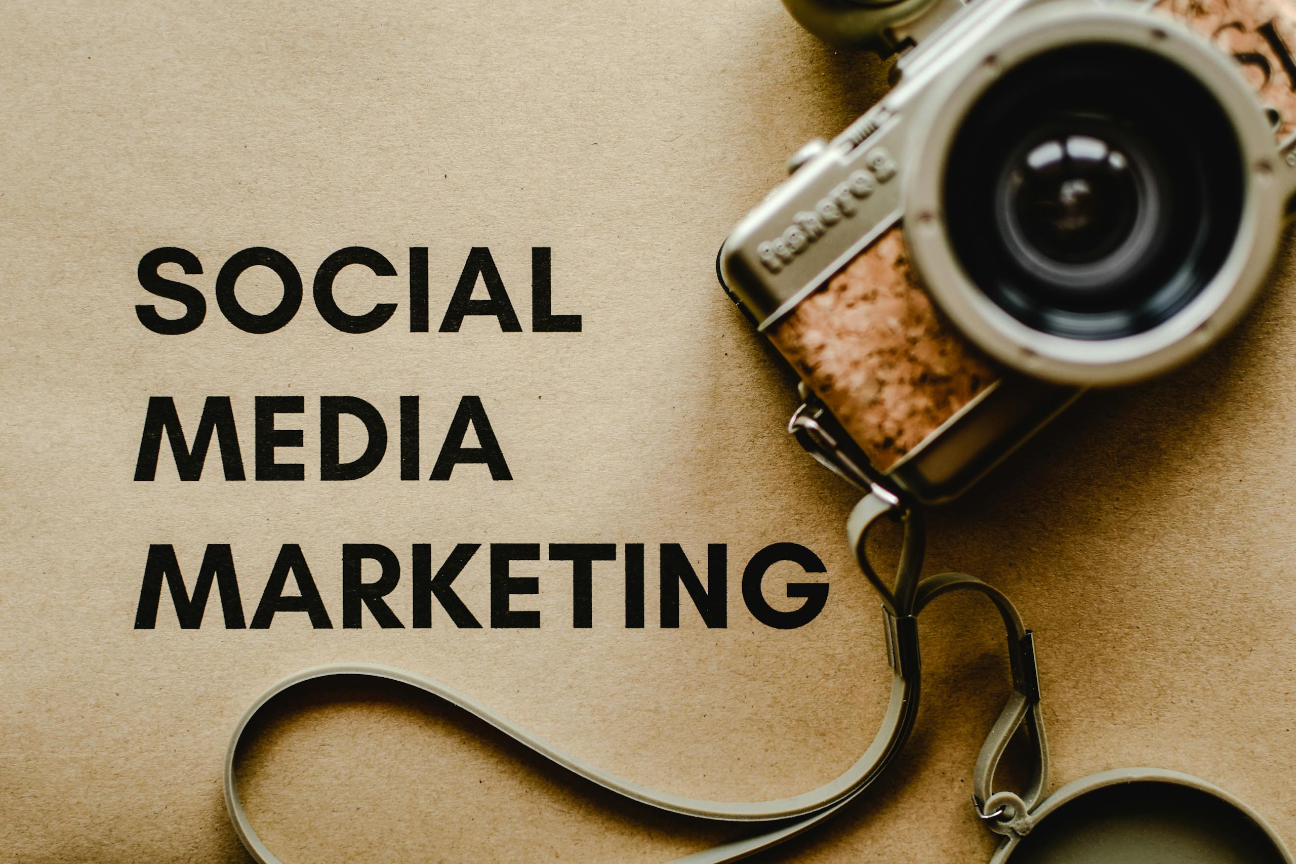 A vintage camera on brown paper with 'SOCIAL MEDIA MARKETING' text, perfect for marketing visuals. smm-company-ludhiana-digitalunicorn